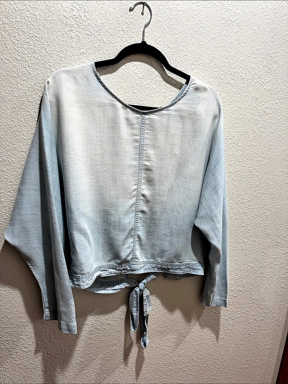 Faded Chambray long sleeve top with tie open back.